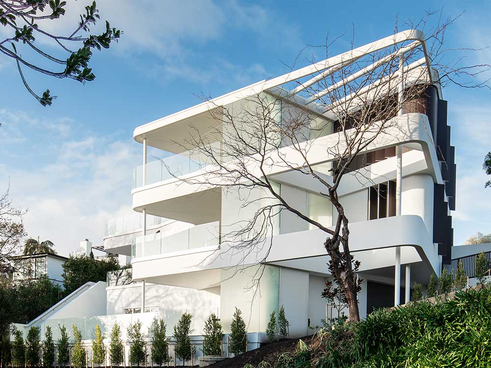 Bent glass facade encapsulates feature staircase at luxury Auckland ... - Glass Facade Design For Luxury Penthouse