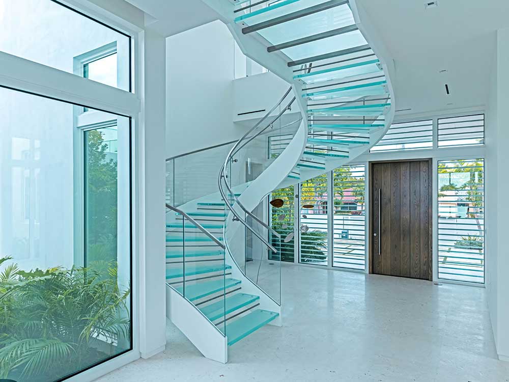 Circular glass staircase takes centre-stage at Miami waterfront house ...